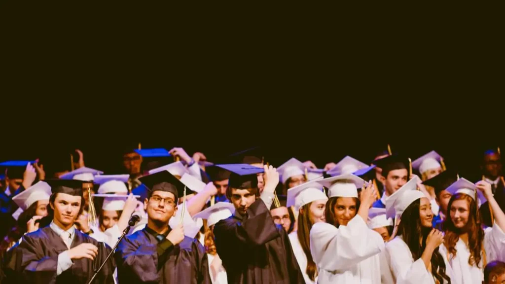 Graduates in caps and gowns at a commencement ceremony